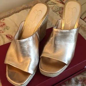 Rose gold leather wedges.